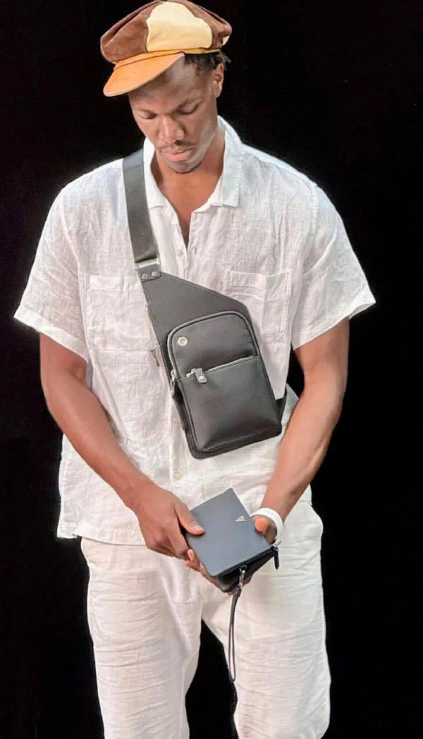 Burhan Zip Wallet in brown leather held on the wrist, WACCO Studio Vancouver