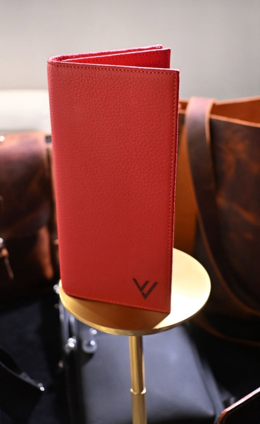 Red wallet on the brass stand, WACCO Studio Vancouver